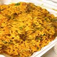 Lamb Biryani · Tender pieces of lamb cooked with rice, dried fruit, nut, and spices.