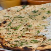 Garlic Naan · Leavened flour bread with a touch of garlic.