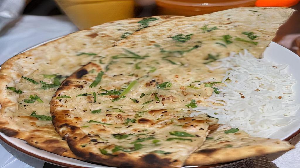 Garlic Naan · Leavened flour bread with a touch of garlic.