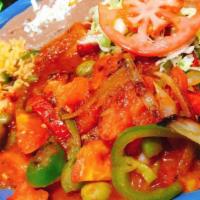 Pescado Acapulco · Fish fillet with peppers, onions in tomato sauce.