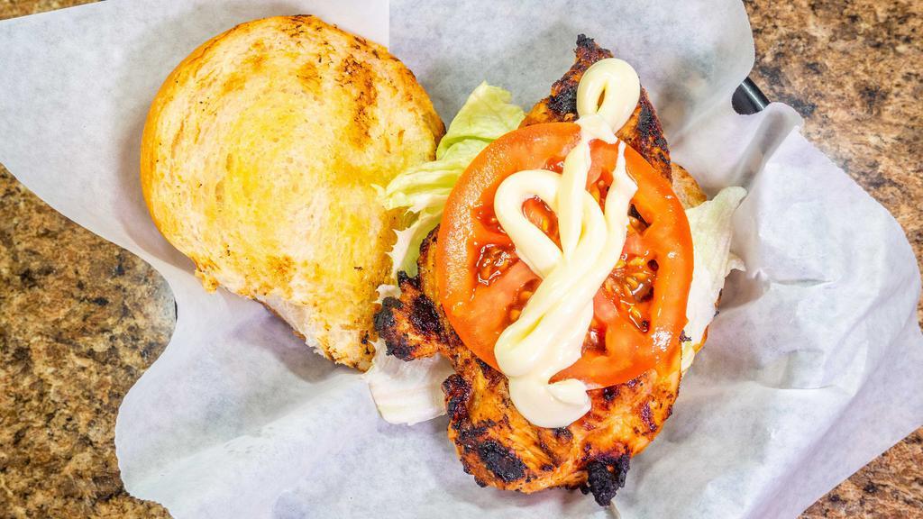 Grilled Marinated Chicken Breast Sandwich · Served with lettuce, tomato, mayo.