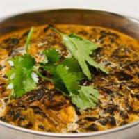 Saag Ponir · Fried cottage cheese cooked with spinach tastefully blended with tomatoes. Medium spiced, se...