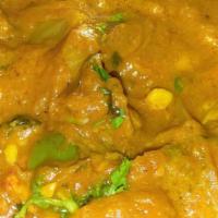 Butter Chicken · Cooked with cream, almond and butter, served with basmati rice.