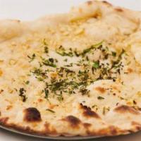 Garlic Naan · Unleavened naan with garlic baked in a clay oven.
