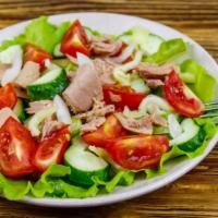 Italian Tuna Salad · Fresh salad made with Italian Tuna salad and tomatoes, served over a bed of fresh greens.