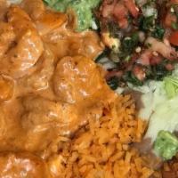 Camarones Al Chipotle · Sautéed shrimp in a creamy chipotle sauce, served with rice, guacamole salad and two tortill...
