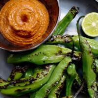 Grilled Shishito Peppers · Grilled shishito peppers and romesco