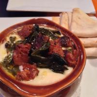 Quesito Fundido · Melted cheese with sauteed poblano peppers, onions, chorizo and frijoles served with flour t...
