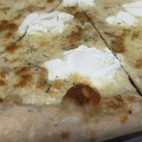 White Pie · A sauceless pie topped with ricotta, mozzarella, and Parmesan cheese.