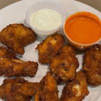 Buffalo Wings · 8 Chicken wings breaded and fried, then tossed in buffalo sauce.