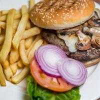 City Burger · 9 oz. burger with cheddar cheese, grilled mushrooms and onions. Served with coleslaw and pic...