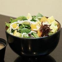 *New* Mandarin Salad · Salad with mandarin, mixed greens, almonds, crispy wontons, crispy rice noodles, and ginger ...