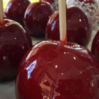 Plain Red Candy Apple · Granny smith apple covered in our storemade red candy coating.