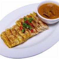 Roti Murtabak 肉碎面包 · Spicy. Roti filled with spiced chicken, egg and onion. Served with curry potato chicken sauce.