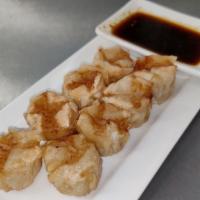 Shu Mai (Shrimp & Pork) · Shrimp and pork stuffed dumplings with house made gyoza sauce.
