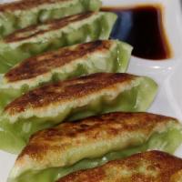 A 6. Vegetable Gyoza · Pan fried veg dumplings with house made gyoza sauce.