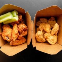 Wing Combo (Large 12 Pc) · 12 boneless or classic (bone-in) wings with up to three dipping sauces on the side, regular ...