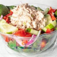 Tuna Salad · Romaine or mixed greens, cherry tomatoes, cucumber topped with your choice of classic or spi...