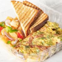 Western Omelette · Omelette with turkey ham, onions and green peppers. Made with three eggs. Served with home f...