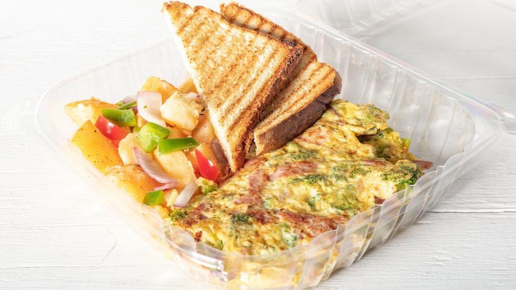 Western Omelette · Omelette with turkey ham, onions and green peppers. Made with three eggs. Served with home fries and toast.