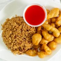 Sweet & Sour Chicken · Served with fried rice and pork egg roll.