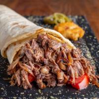 The Halal Gyro Wrap · NY classic gyro meat wrap made with lettuce, tomato, and chef's sauce.