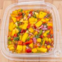 Mango Salsa  · mango salsa . FRESH CHOPPED onions green and red peppers ,cilantro and sweet habanero sause .