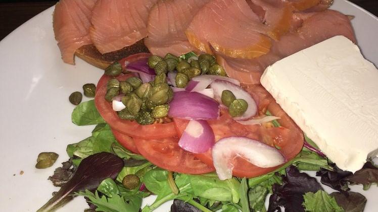 Smoked Fish Platter Nova Salmon · Served with cream cheese, lettuce, tomato, onion, capers, and a bagel.