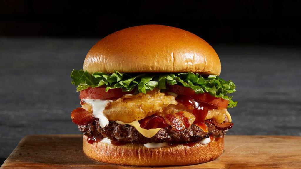 Bbq Bacon Tribeca Burger · A 4 oz fresh Angus beef patty, BBQ sauce, onion rings, bacon, lettuce, tomato, and American cheese.