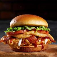 Bbq Bacon Tribeca · A 5 oz deep-fried chicken breast, BBQ sauce, onion rings, bacon, lettuce, and tomato.