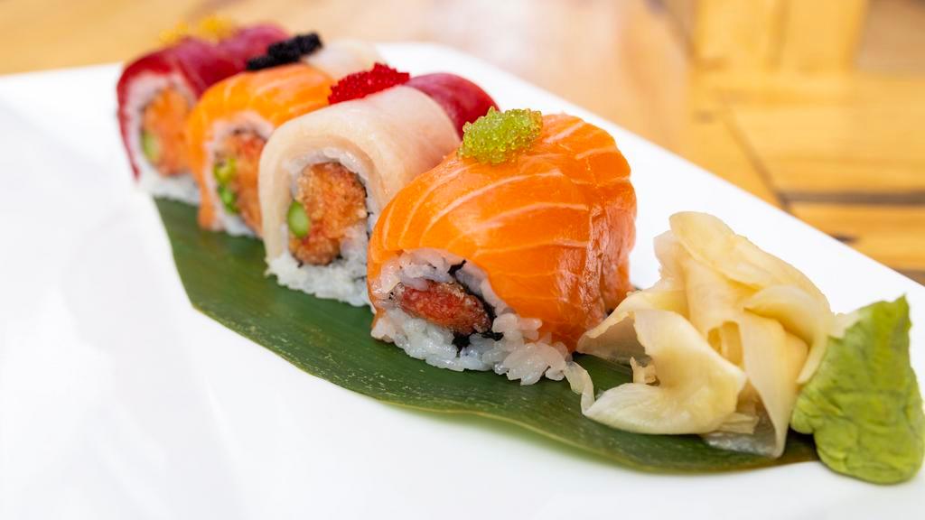 Spicy Girl Roll · Spicy crunchy tuna, salmon, yellowtail, asparagus with tuna, salmon, yellowtail & tobiko on top roll
