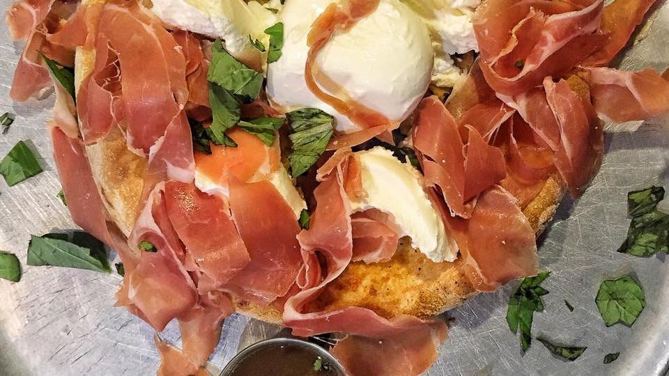 Panuozzo · One size only. freshly baked bread seasoned with olive oil, pecorino romano cheese & basil. Topped with ricotta, fresh mozzarella, prosciutto & our homemade sweet balsamic glaze.