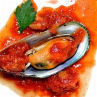 Mussels · New Zealand mussels with marinara sauce.