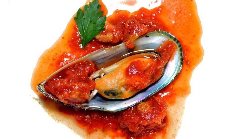 Mussels · New Zealand mussels with marinara sauce.