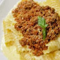 Pappardelle · lasagna style pasta sheets in a rich alfredo sauce with a dollop of pork & beef meat sauce o...