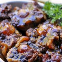 Oxtail · Jamaican Oxtail is a delicious dish made in a stew braised with flavorful deep gravy. Succul...