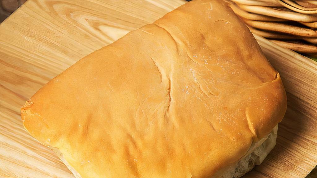 Coco Bread · Coco bread is eaten in Jamaica and other areas of the Caribbean. The bread contains some coconut milk, and is starchy and slightly sweet in taste. It is often split in half and stuffed with a Jamaican patty to form a sandwich.