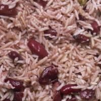 Rice And Peas · Jamaican style steamed rice and peas with a touch of ginger, coconut milk and other flavors.