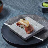 Wagyu-Scallop Nigiri · A5 Wagyu with hokkaido scallop. Served with chef's choice of toppings.