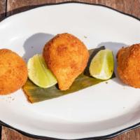 Coxinha · Fried croquettes filled with shredded chicken breast, scallions and cream cheese.