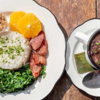 Feijoada · Smoked pork meat black bean stew with rice, collard greens, tomato salsa, yucca flour and or...