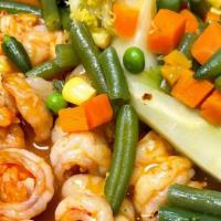 Gambas Ajillo · Shrimp in garlic sauce served with rice and vegetables.