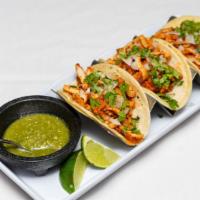 Tacos · (3) Tacos double tortilla choice or protein. Topped with cilantro and onion on soft corn tor...