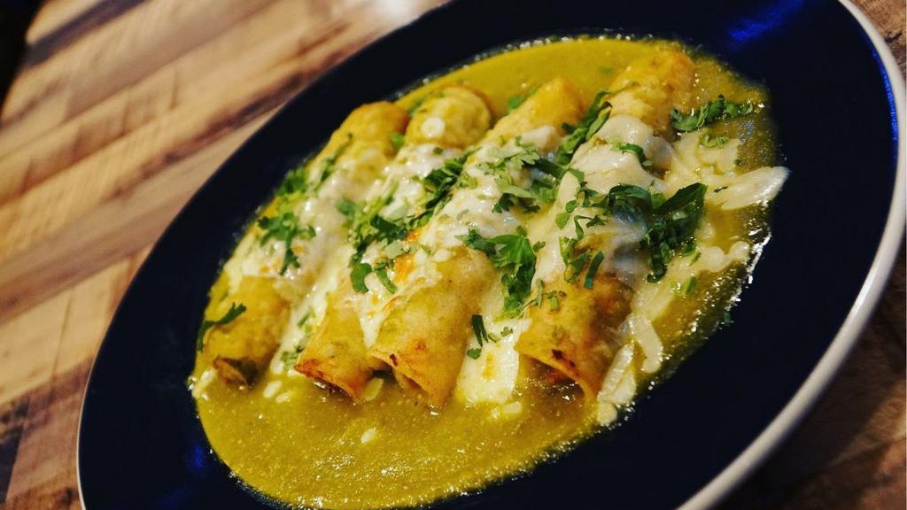 Enchiladas
 · (4) Chicken enchiladas in green sauce or mole sauce. Topped with cheese. Served with rice and beans.
