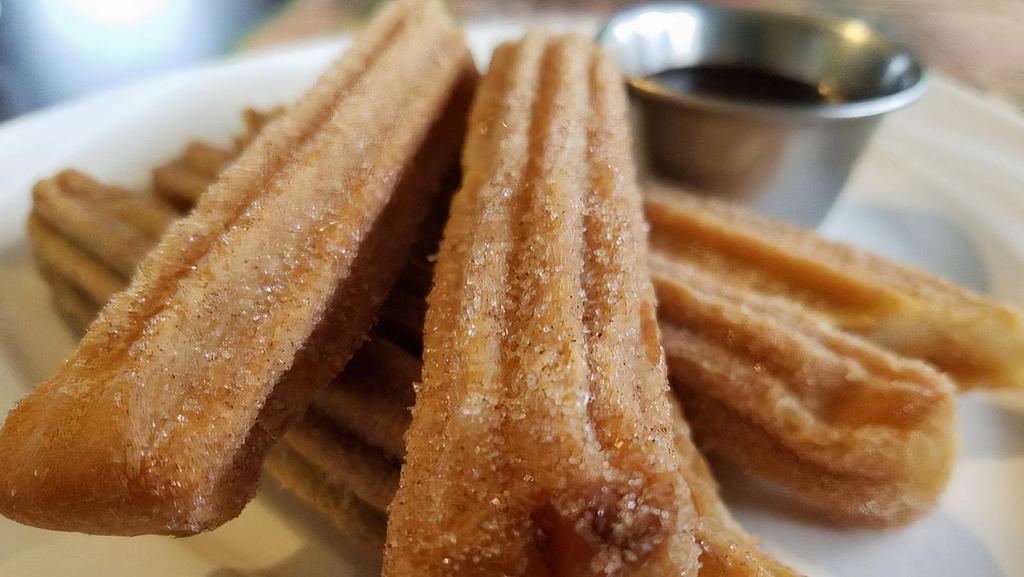 Caramel Stuffed Churros · 6 five in churros stuffed with caramel coated in cinnamon sugar. Served Chocolate dipping sauce
