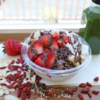 Coco Classic · Coconut topped with banana, strawberry, cacao nibs, coconut flakes, chocolate macadamia driz...