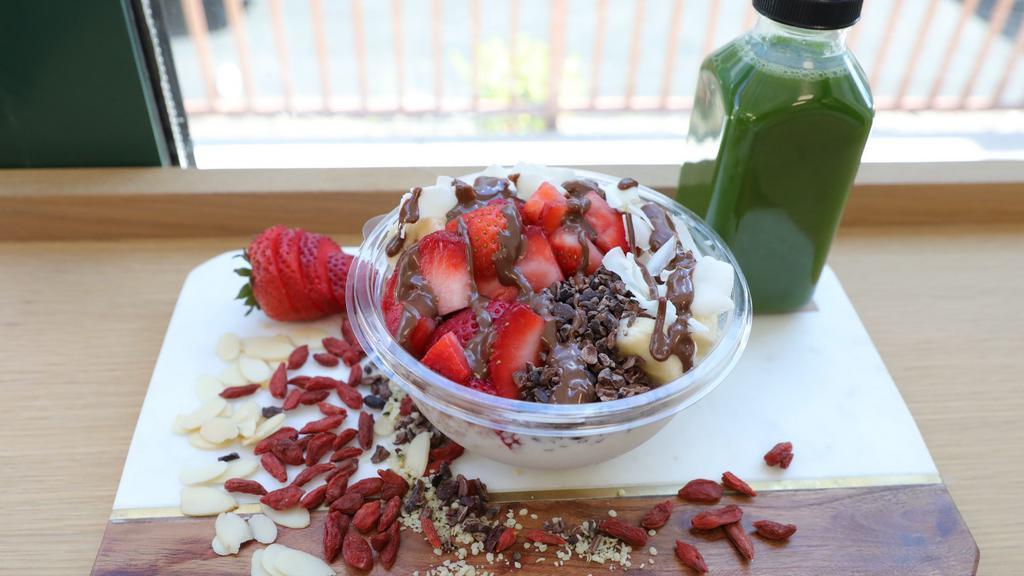 Coco Classic · Coconut topped with banana, strawberry, cacao nibs, coconut flakes, chocolate macadamia drizzle, granola.