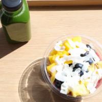 Summer Breeze · Pitaya topped with mango, pineapple, blueberry, coconut flakes, granola.