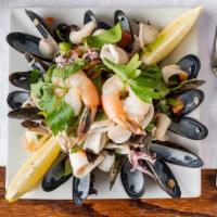 Il Piccolo Bufalo Seafood Salad · Shrimp, clams mussels, calamari, and scungilli.