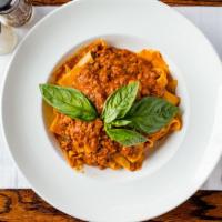 Pappardelle Bolognese · A classic meat sauce simmered for hours, delicious.